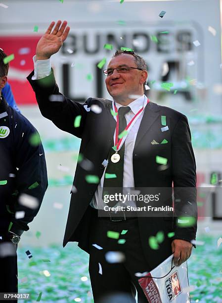 Felix Magath, head coach of Wolfsburg celebrates the German championship after their Bundesliga match against SV Werder Bremen at Volkswagen Arena on...