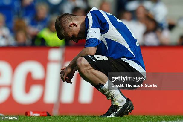 Artur Wichniarek of Bielefeld looks dejected after the Bundesliga match between Arminia Bielefeld and Hannover 96 at the Schueco Arena on May 23,...