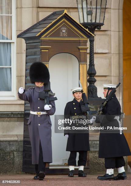 Able seaman Alex Stacey takes her position in a sentry box, as sailors from the Royal Navy perform the Changing of the Guard ceremony at Buckingham...