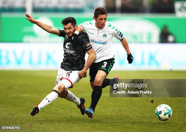 Cenk Sahin of FC St. Pauli is challenged by Maximilian Wittek of SpVgg Greuther Fuerth during the Second Bundesliga match between SpVgg Greuther...