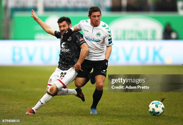 Cenk Sahin of FC St. Pauli is challenged by Maximilian Wittek of SpVgg Greuther Fuerth during the Second Bundesliga match between SpVgg Greuther...