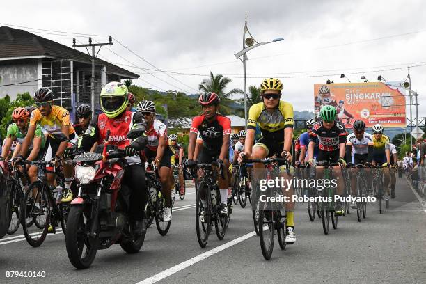 Cyclists compete during stage 9 of the Tour de Singkarak 2017, Pasaman-Bukittinggi 117,2 km on November 26, 2017 in Bukittinggi, Indonesia.