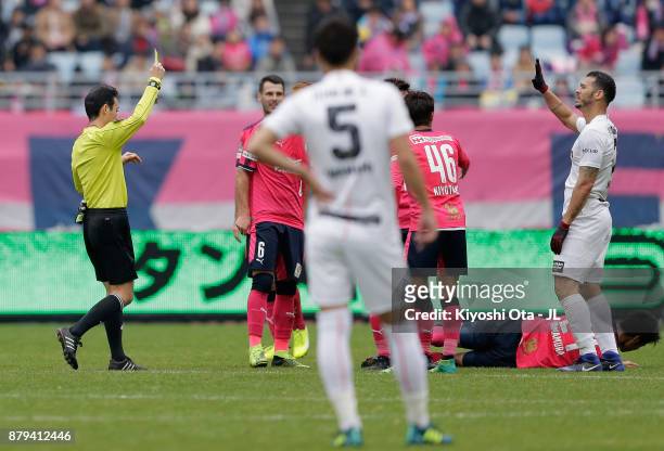 Nilton of Vissel Kobe is shown a yellow card by referee Hiroyuki Kimura during the J.League J1 match between Cerezo Osaka and Vissel Kobe at Yanmar...