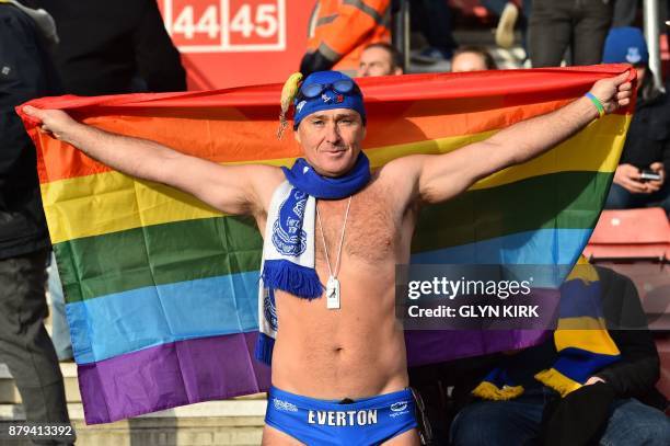 Famous Everton supporter 'Speedo Mick' holds up a rainbow flag in the crowd, in support of Stonewall's rainbow laces campaign during the English...