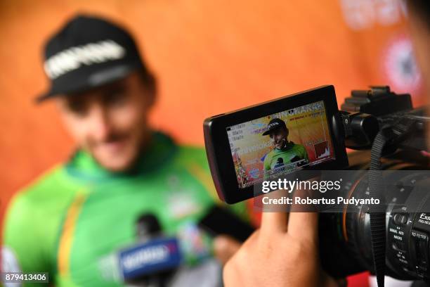 Green jersey winner Robert Muller of ETW Embrace the World Cycling Germany is interviewed during stage 9 of the Tour de Singkarak 2017,...