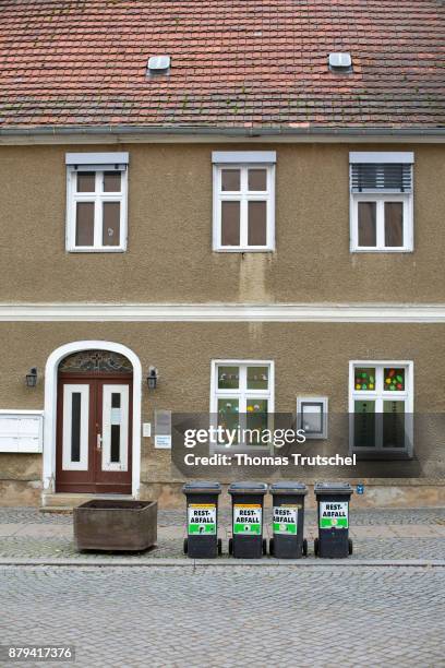 Luebben, Germany Dustbins with the words 'residual waste' are standing in front of a house on November 19, 2017 in Luebben, Germany.