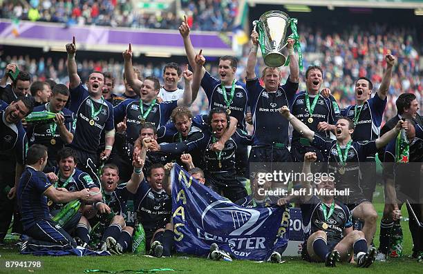 The Leinster players celebrate with the trophy following their victory at the end of the Heineken Cup Final match between Leicester Tigers and...