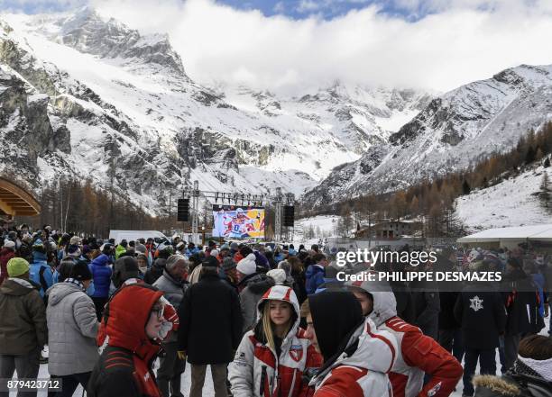 People attend a ceremony in memory of late French skier David Poisson in Peisey-Nancroix, in the French Alps, on November 26, 2017. French skier...