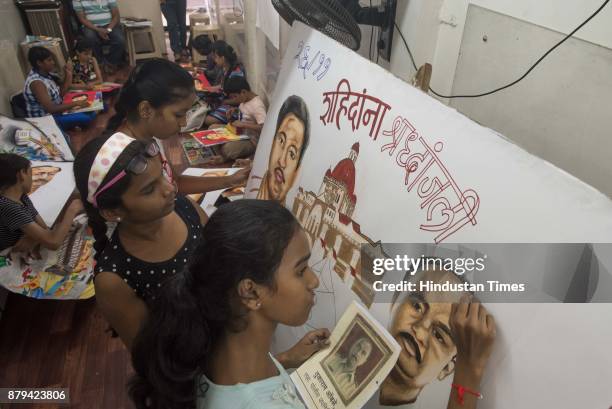 Child artists from Gurukul School of Art made paintings to give tribute to 26/11 martyrs at Curry road, on November 25, 2017 in Mumbai, India.