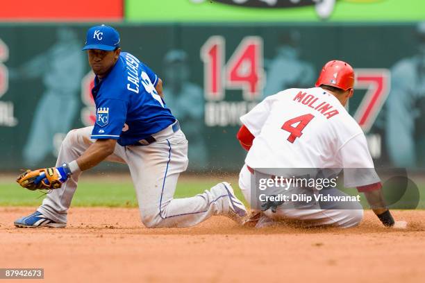 Yadier Molina of the St. Louis Cardinals steals second base against Alberto Callaspo of the Kansas City Royals on May 23, 2009 at Busch Stadium in...