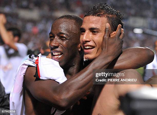 Bordeaux' forward Marouane Chamakh and defender Souleymane Diawara salute the public at the end of the French L1 football match Bordeaux vs Monaco on...