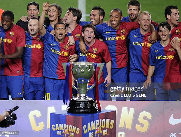 Barcelona players celebrate their victory in the Spanish league title 2009 and the Spanish King's Cup 2009 after their Spanish League football match...