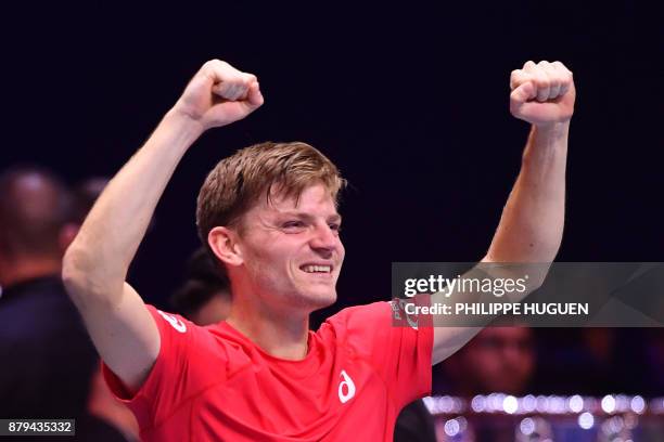 Belgium's David Goffin reacts after winning his singles rubber 4 against France's Jo-Wilfried Tsonga at the Davis Cup World Group final tennis match...