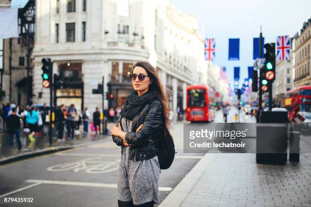 young woman walking in central london - daily life at oxford street london stock pictures, royalty-free photos & images