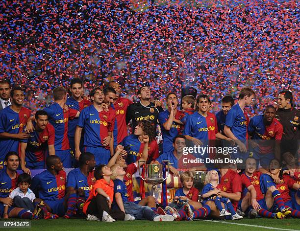 Barcelona players celebrate with the La Liga trophy after the La Liga match between Barcelona and Osasuna at the Nou Camp stadium on May 23, 2009 in...