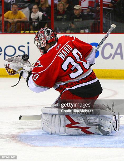 Goaltender Cam Ward of the Carolina Hurricanes saves a shot on goal by the Pittsburgh Penguins during Game Three of the Eastern Conference...