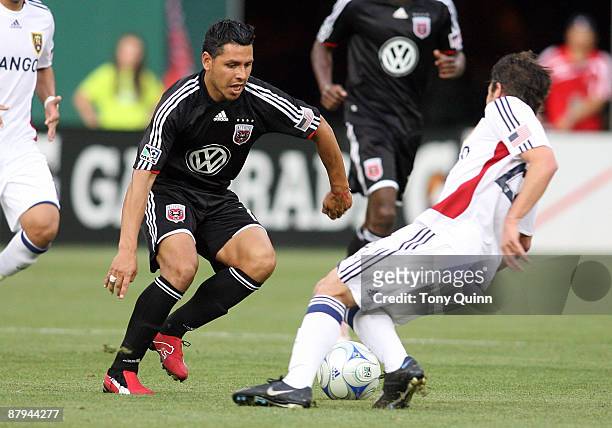 Christian Gomez of D.C. United cuts past Ned Grabavoy of Real Salt Lake at RFK Stadium on May 23, 2009 in Washington, DC.