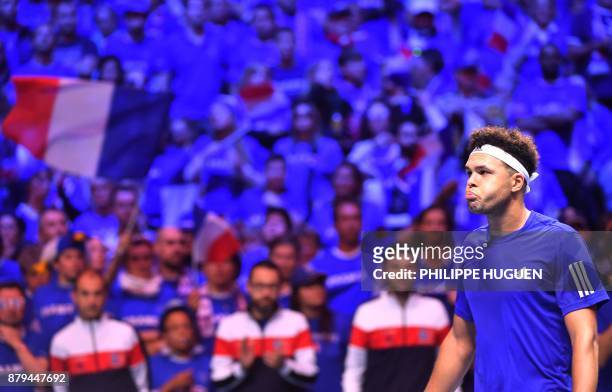 France's Jo-Wilfried Tsonga reacts during his singles rubber 4 of the Davis Cup World Group final tennis match between France and Belgium at The...