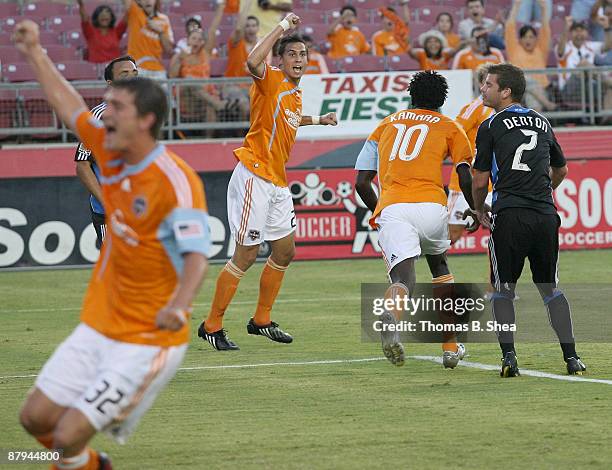 Geoff Cameron and Bobby Boswell celebrate Kei Kamara of the Houston Dynamo goal while Eric Denton of the San Jose Earthquakes defends on the play at...
