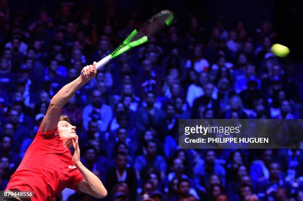 Belgium's David Goffin serves the ball to France's Jo-Wilfried Tsonga during their singles rubber 4 of the Davis Cup World Group final tennis match...