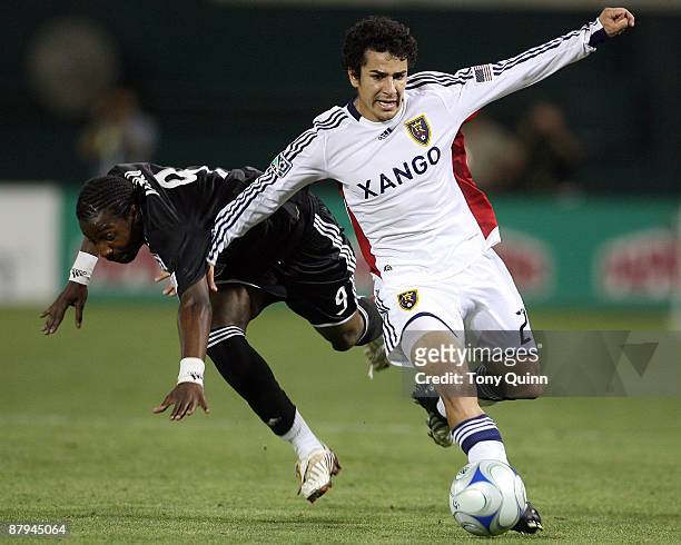 Ange N'Silu of D.C. United is knocked off the ball by Tony Beltran of Real Salt Lake at RFK Stadium on May 23, 2009 in Washington, DC. The game ended...