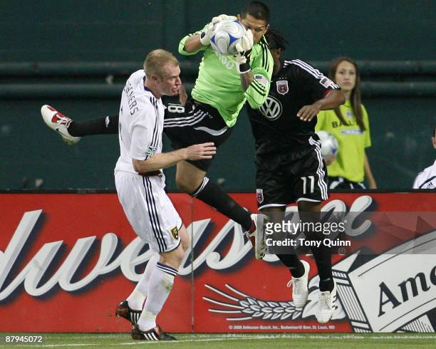 Luciano Emilio of D.C. United is beaten to the ball by Nick Rimando of Real Salt Lake at RFK Stadium on May 23, 2009 in Washington, DC. The game...