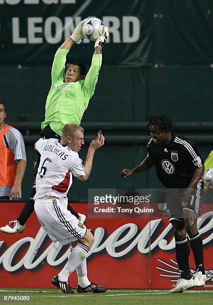 Luciano Emilio of D.C. United loses the ball to a high leap by Rick Rimando of Real Salt Lake at RFK Stadium on May 23, 2009 in Washington, DC. The...