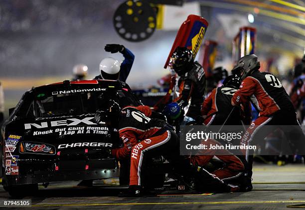 David Gilliland, driver of the nexusnes.org Dodge, pits during the NASCAR Nationwide Series CARQUEST Auto Parts 300 on May 23, 2009 at Lowe's Motor...