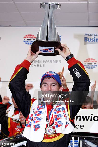 Mike Bliss, driver of the Miccosukee Indian Gaming & Resort Chevrolet, celebrates in victory lane after winning the NASCAR Nationwide Series CARQUEST...