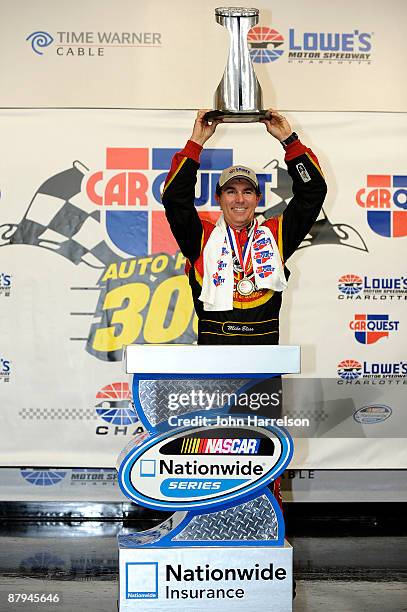 Mike Bliss, driver of the Miccosukee Indian Gaming & Resort Chevrolet, poses in victory lane after winning the NASCAR Nationwide Series CARQUEST Auto...