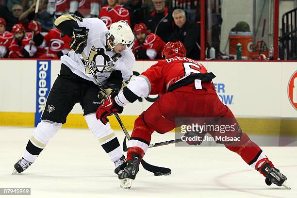 Sidney Crosby of the Pittsburgh Penguins skates against Tim Gleason of the Carolina Hurricanes during Game Three of the Eastern Conference...