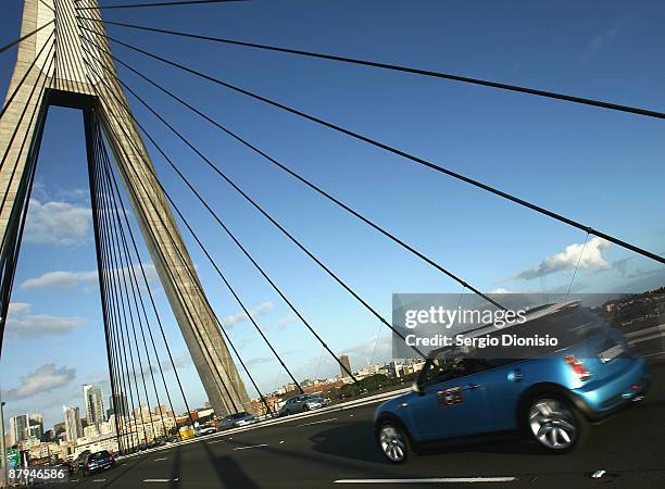 Mini Cooper owners drive over the Anzac Bridge during the 50 year celebration of the Mini in Australia on May 24, 2009 in Sydney, Australia. This...