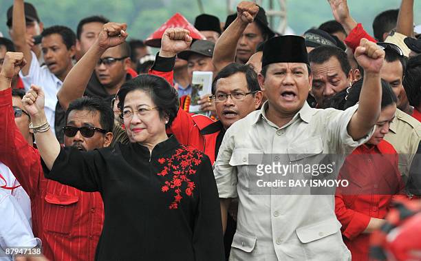 Former Indonesian president Megawati Sukarnoputri , head of the Indonesian Democratic Party of Struggle , and her running mate, former military...