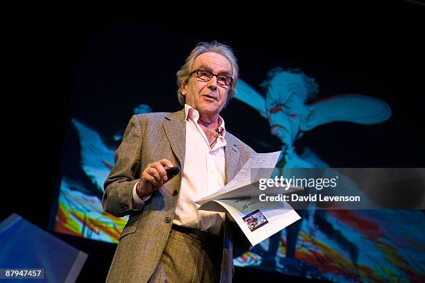 Gerald Scarfe ,cartoonist, gives a talk with some of his political cartoons behind him at the Hay festival on May 24, 2009 in Hay-on-Wye, Wales.