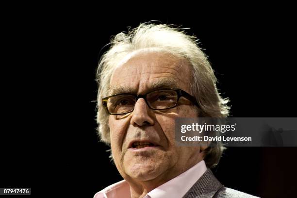 Gerald Scarfe ,cartoonist, gives a talk with some of his political cartoons behind him at the Hay festival on May 24, 2009 in Hay-on-Wye, Wales.