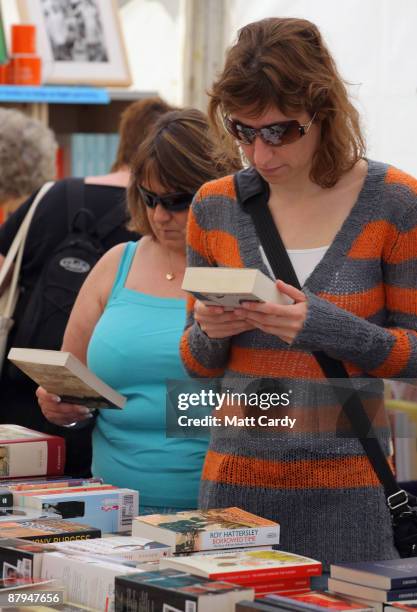 Festival-goers browse books during the fourth day of the Guardian Hay Festival 2009 on May 24, 2009 in Hay-on-Wye, Wales. Sky Arts once again returns...