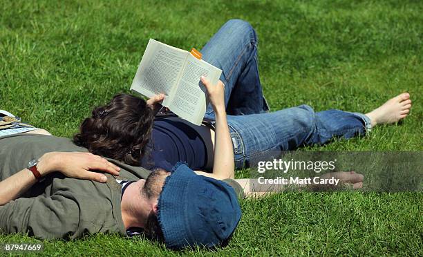 Festival-goers enjoy the fine weather during the fourth day of the Guardian Hay Festival 2009 on May 24, 2009 in Hay-on-Wye, Wales. Sky Arts once...