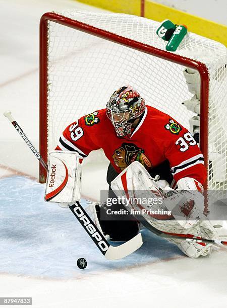 Goalie Nikolai Khabibulin of the Chicago Blackhawks makes a save against the Detroit Red Wings during Game Three of the Western Conference...