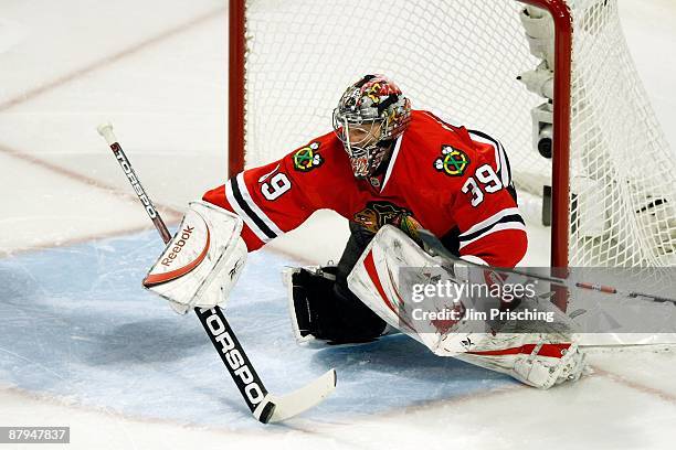 Goalie Nikolai Khabibulin of the Chicago Blackhawks makes a save against the Detroit Red Wings during Game Three of the Western Conference...