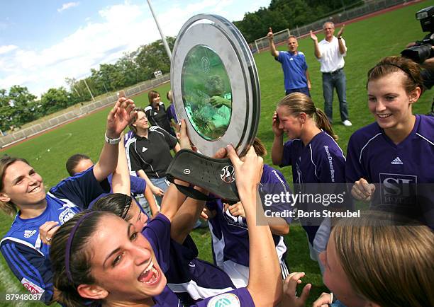 The team of TeBe Berlin celebrates the ascension to the First Bundesliga after winning the Women's Second Bundesliga match between Tennis Borussia...