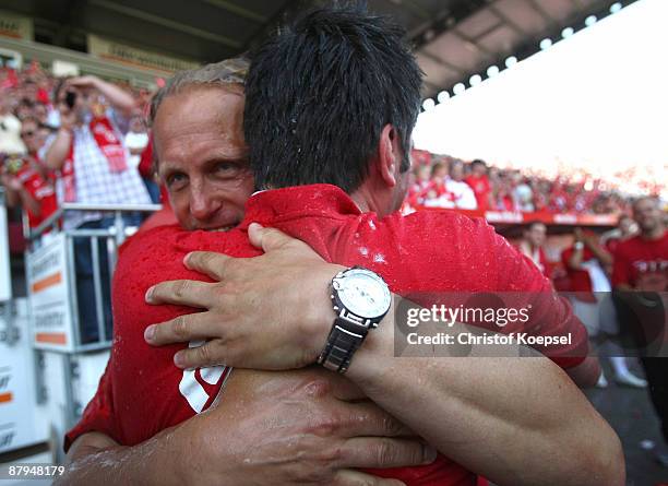 Manager Christian Heidel of Mainz embraces head coach Joern Andersen of Mainz after winning 4-0 and during the second Bundesliga match between FSV...