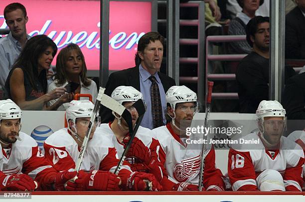 Head coach Mike Babcock of the Detroit Red Wings looks on from behind the bench against the Chicago Blackhawks during Game Three of the Western...