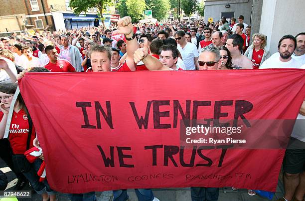 Arsenal fans participate in a planned rally in support of their manager Arsene Wenger before the Barclays Premier League match between Arsenal and...