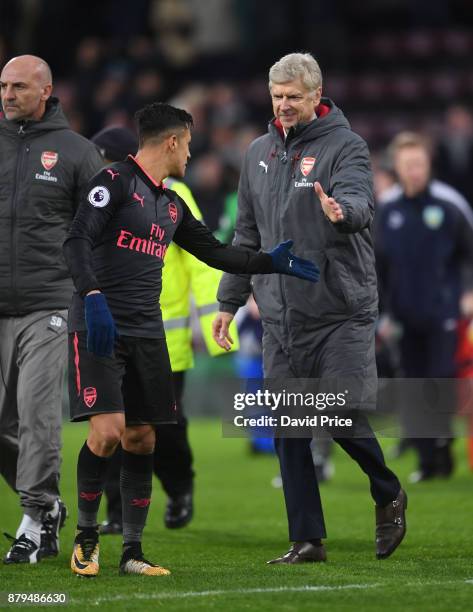 Arsene Wenger the Arsenal Manager with Alexis Sanchez after the Premier League match between Burnley and Arsenal at Turf Moor on November 26, 2017 in...