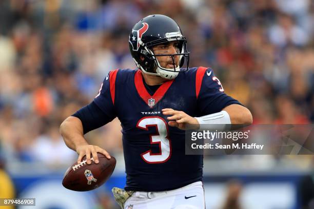Tom Savage of the Houston Texans looks to pass during the first half of game against the Los Angeles Rams at Los Angeles Memorial Coliseum on...