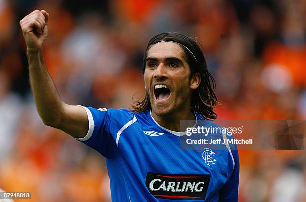 Pedro Mendes of Rangers celebrates after scoring the second goal during the Scottish Premier League match between Dundee United and Rangers at...