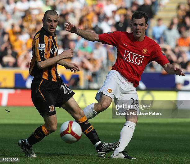 Darron Gibson of Manchester United clashes with Dean Marney of Hull City during the Barclays Premier League match between Hull City and Manchester...