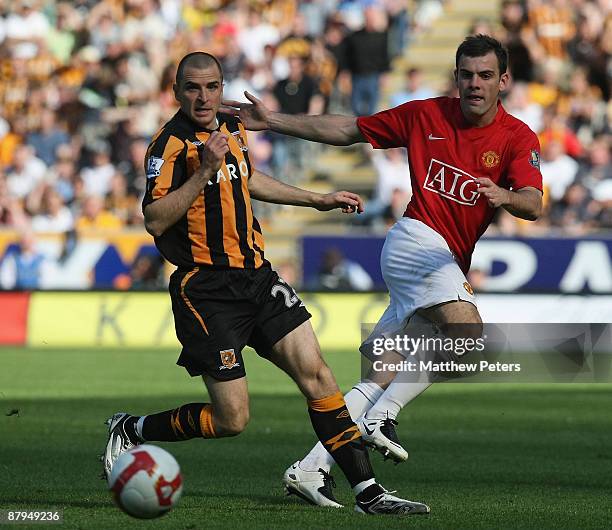 Darron Gibson of Manchester United clashes with Dean Marney of Hull City during the Barclays Premier League match between Hull City and Manchester...