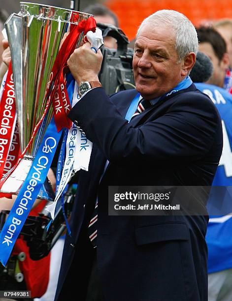 Walter Smith coach of Rangers celebrates winning the Scottish Premier League trophy after the Scottish Premier League match between Dundee United and...