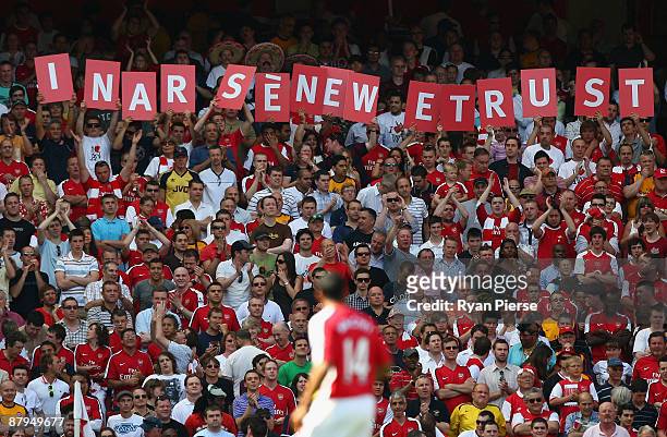 Arsenal fans show support for their manager Arsene Wenger before the Barclays Premier League match between Arsenal and Stoke City at Emirates Stadium...
